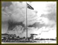 The U.S. Flag flies over Hickam Field after the attack.